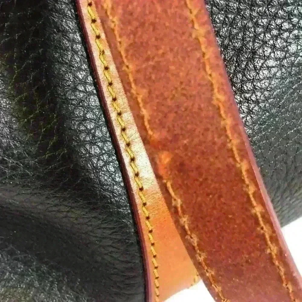 Dooney & Bourke Black Tan Tassel Handbag